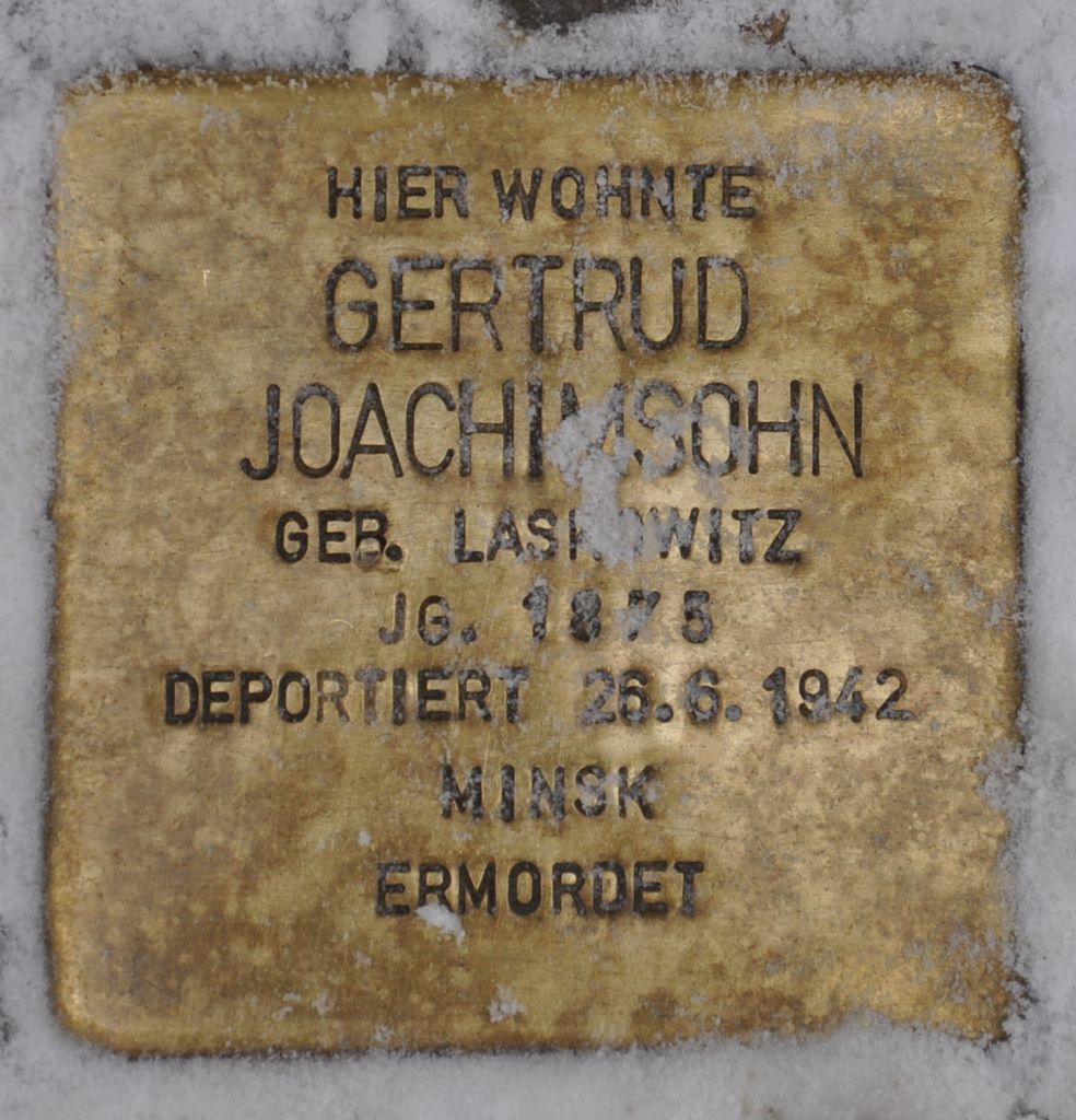 Memorial plaques and sign for people deported from Berlin