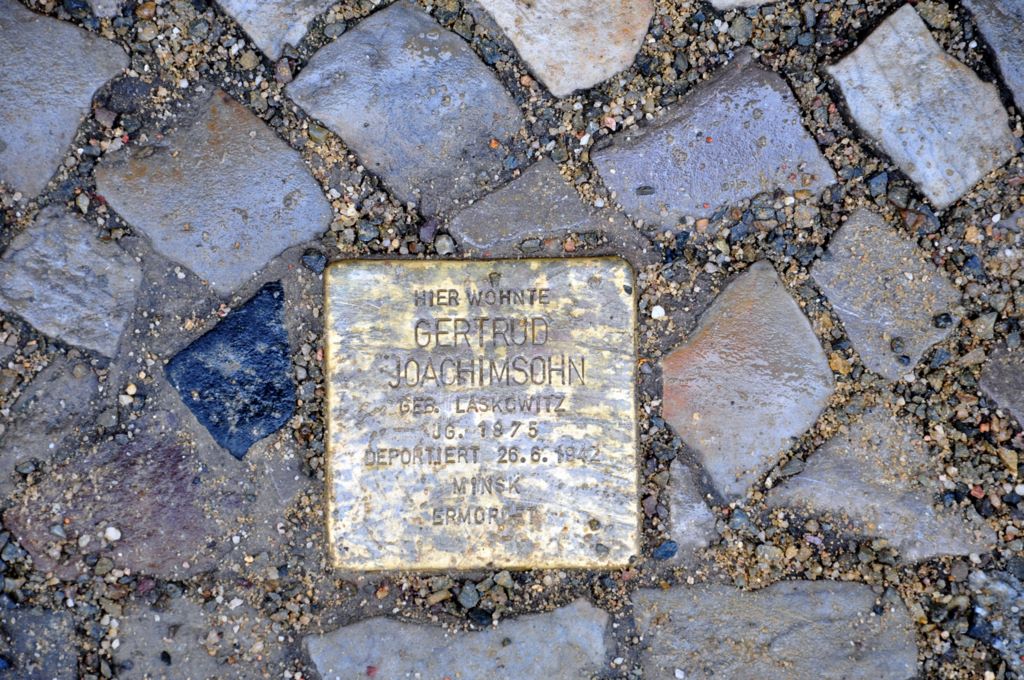 Memorial plaques and sign for people deported from Berlin
